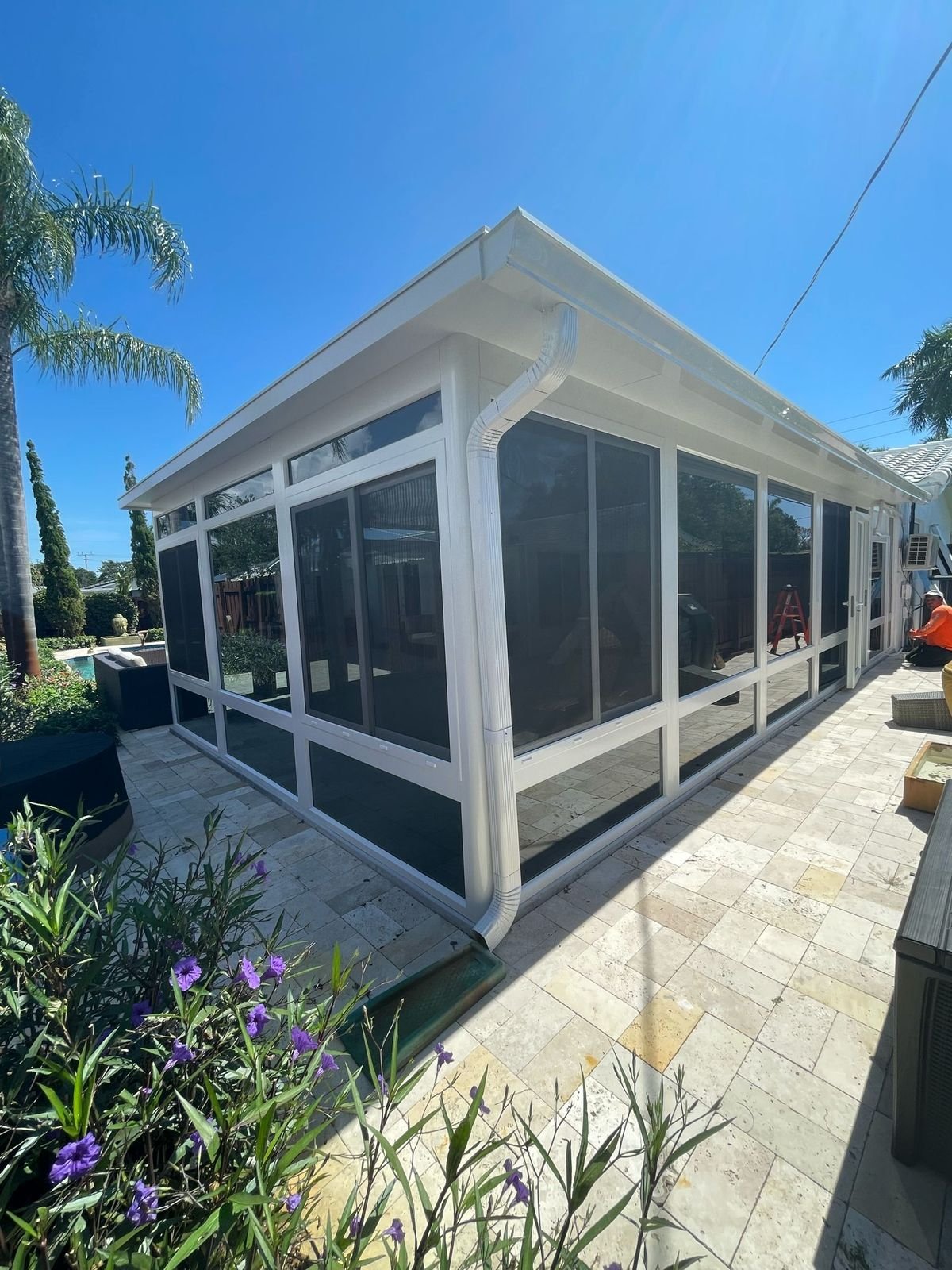 Large white aluminum and glass sunroom
