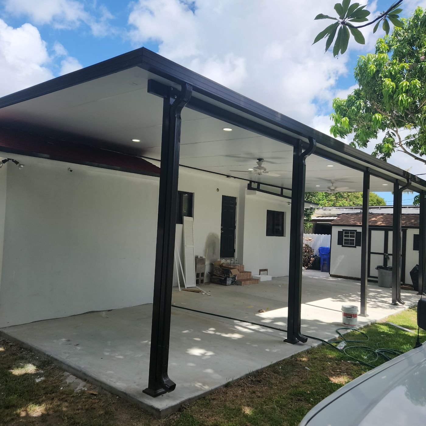 Crew installing insulated roof panels at the González home